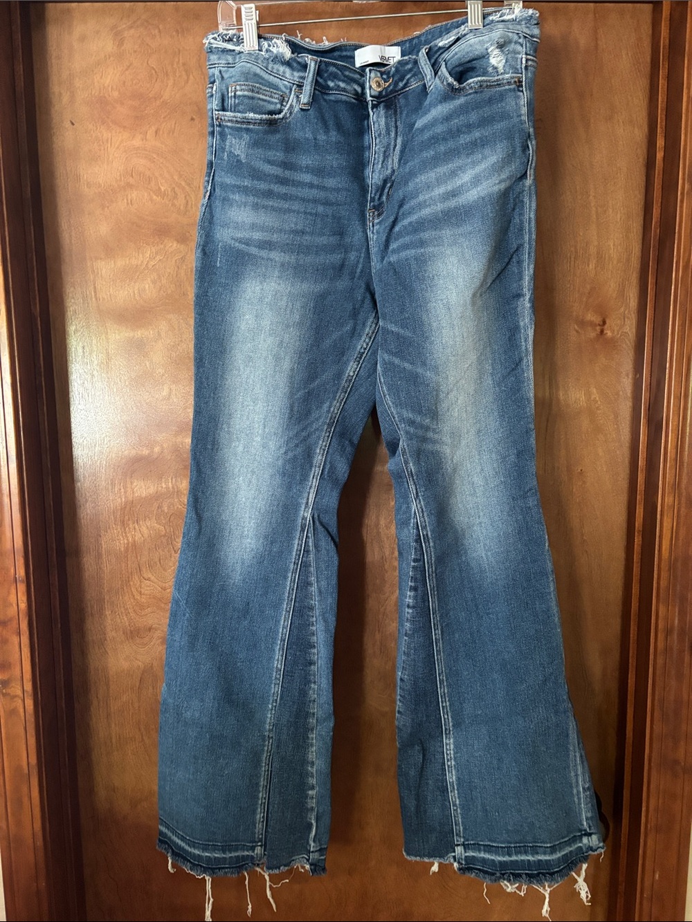 Vintage-Inspired Blue Flare Jeans with Frayed Hem - Picture 1 of 2